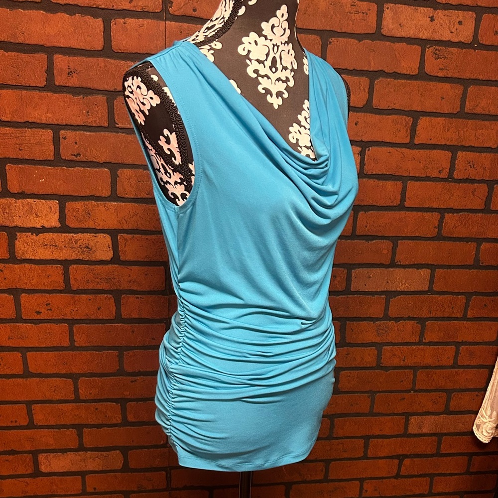 Sexy fitted dress. Beautiful aqua blue. Photo unedited. In excellent condition.